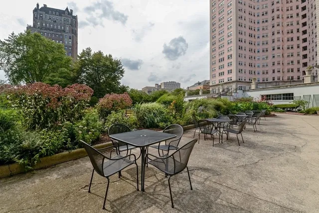 a view of a chairs and table in a patio