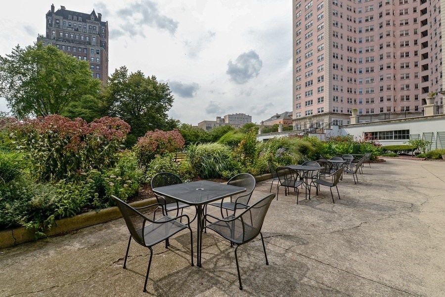 5555 North Sheridan Road, Unit 609 Chicago, IL 60640 - Photo 18 of 24 a view of a chairs and table in a patio