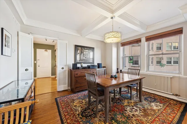 a workspace with furniture window and wooden floor