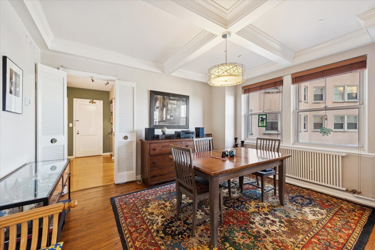 5555 North Sheridan Road, Unit 609 Chicago, IL 60640 - Photo 6 of 24 a workspace with furniture window and wooden floor