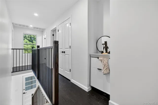 a bedroom with two beds and a night stand