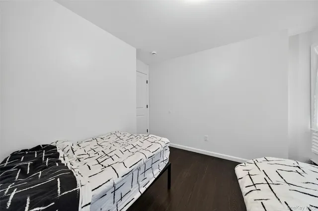 a white toilet sitting next to a bath tub