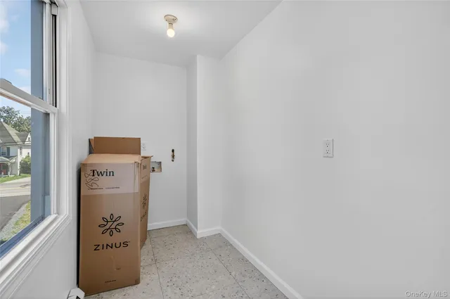 a view of an empty room with a window