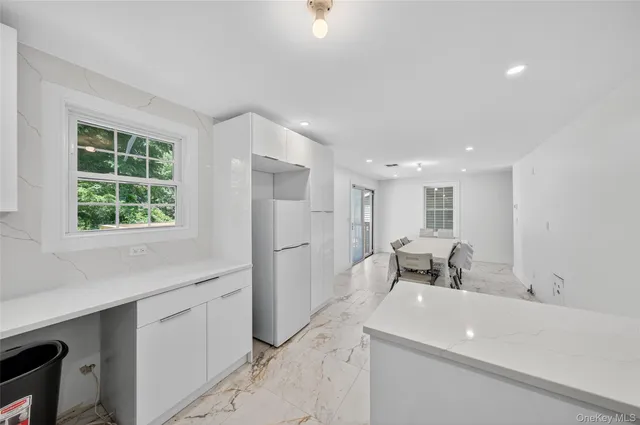 a living room with a sink furniture and a window