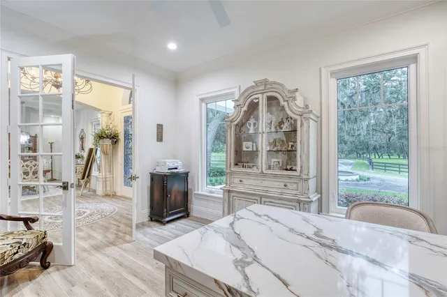 a kitchen with stove and cabinets