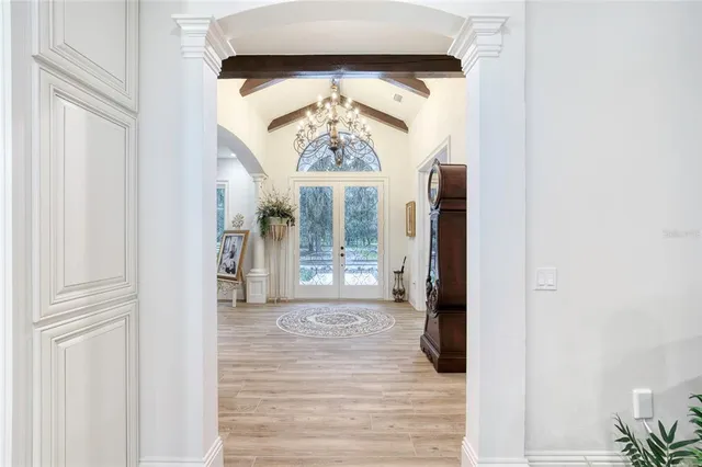 a kitchen with stainless steel appliances a cabinets and a window