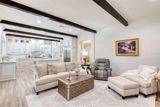 a bathroom with double vanity sink a mirror and a shower