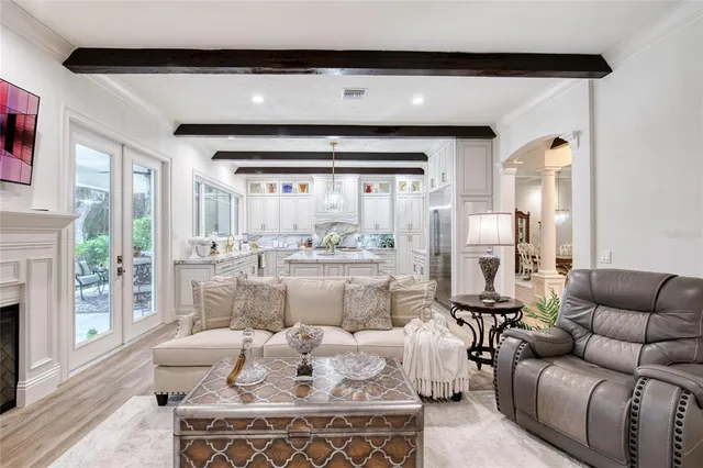 a bedroom with furniture and a flat screen tv