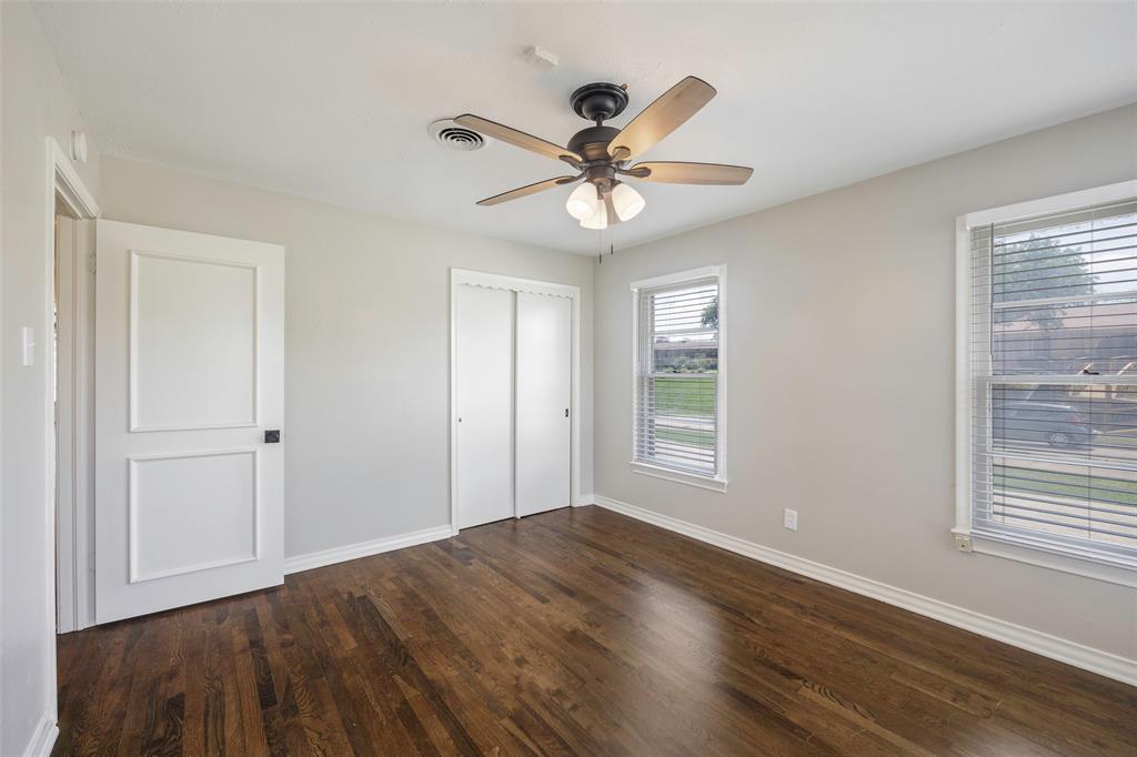 2323 Sutter Street Dallas, TX 75216 - Photo 22 of 30 Unfurnished bedroom with dark hardwood / wood-style floors and ceiling fan