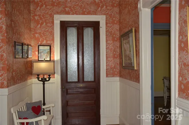 a view of a hallway with front door