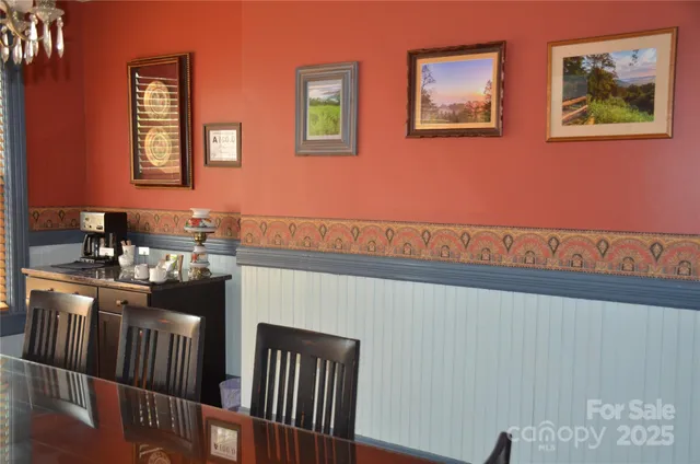 a view of a livingroom with furniture window and wooden floor