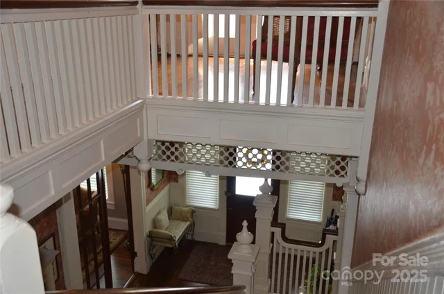a bathroom with a granite countertop sink and a window