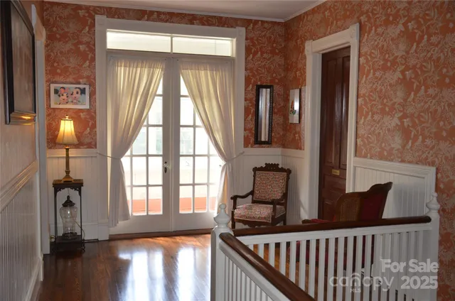a bathroom with a sink a mirror and a window