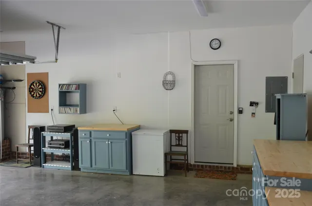 a view of storage and utility room with closet