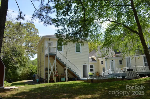 a view of house with yard