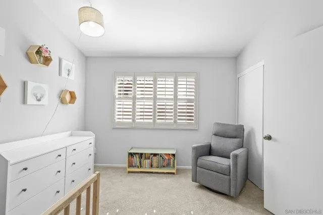 a living room with furniture and a walk in closet