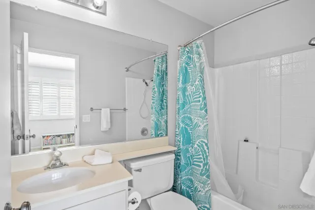 a view of a balcony with a potted plant