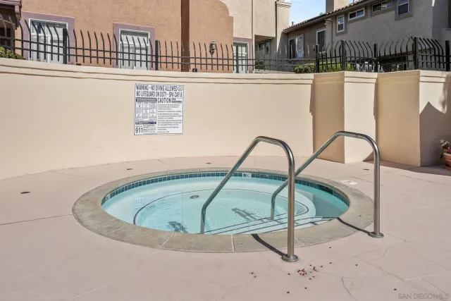 a swimming pool with outdoor seating and yard