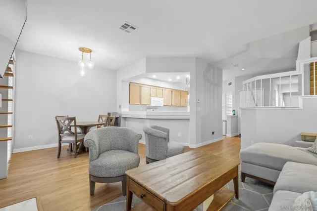 a view of a room with furniture and window