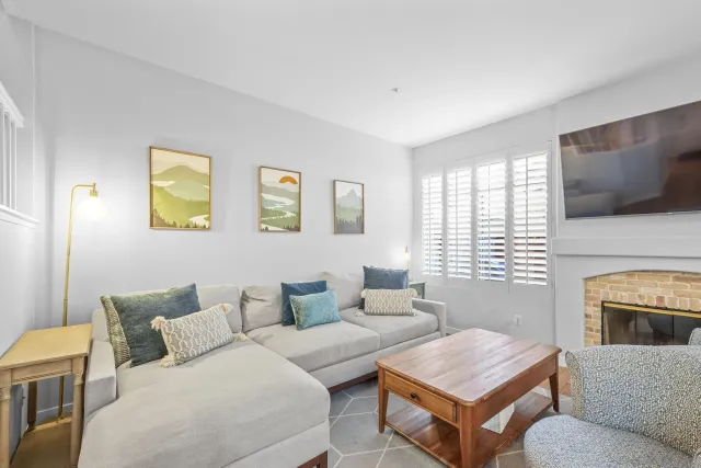 a kitchen with cabinets appliances a sink and a window