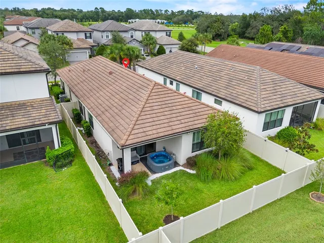 a aerial view of a house with a yard