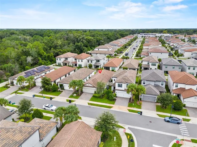 an aerial view of residential houses with outdoor space