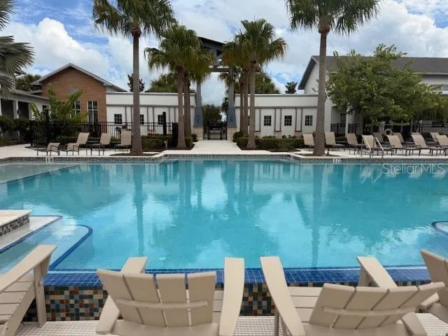 a view of a swimming pool with a table and chairs