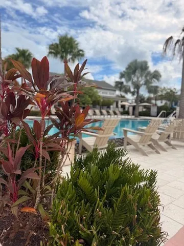 a view of a table and chairs in the garden