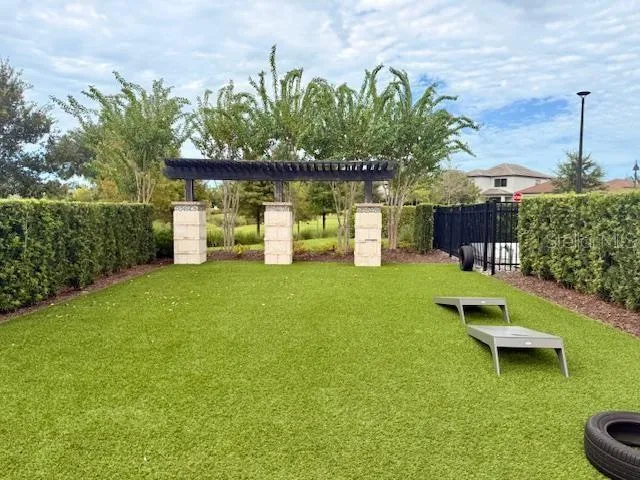 a view of a house with a backyard