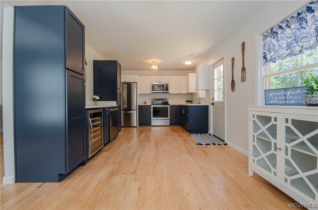 15073 Neck Trail Doswell, VA 23047 - Photo 15 of 50 a open kitchen with stainless steel appliances kitchen island granite countertop a refrigerator and a stove top oven