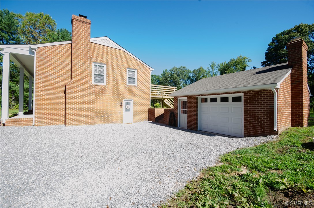 15073 Neck Trail Doswell, VA 23047 - Photo 2 of 50 a front view of house with yard and trees in the background