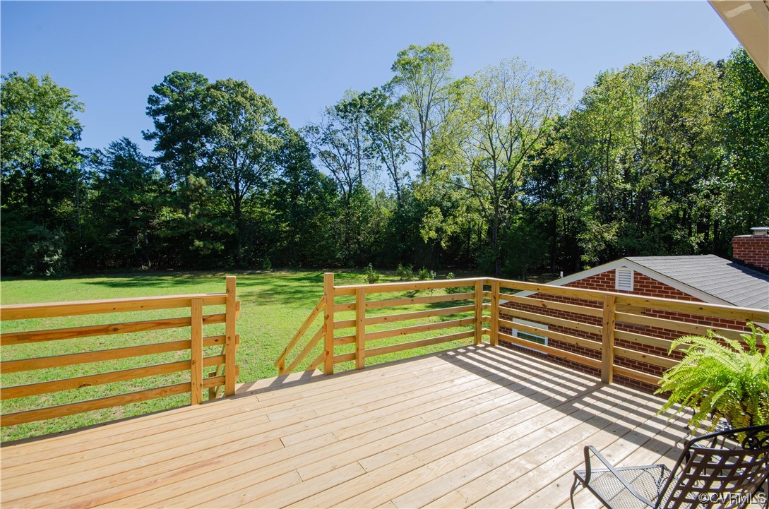 15073 Neck Trail Doswell, VA 23047 - Photo 39 of 50 a view of swimming pool with seating space and trees in the background