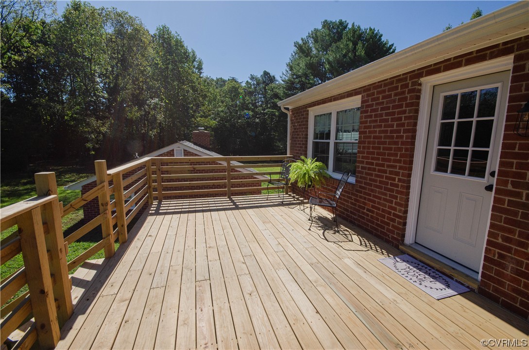 15073 Neck Trail Doswell, VA 23047 - Photo 40 of 50 a view of deck with wooden floor and outdoor seating