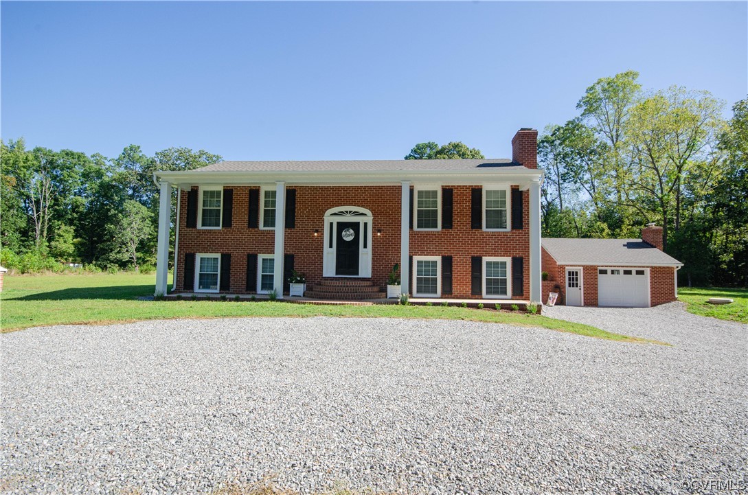 15073 Neck Trail Doswell, VA 23047 - Photo 50 of 50 a front view of a house with a yard and trees