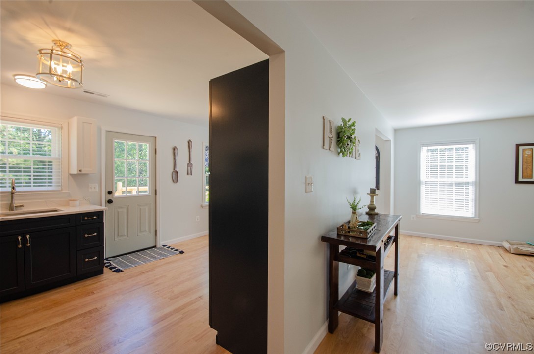 15073 Neck Trail Doswell, VA 23047 - Photo 7 of 50 a view of a dining room with hardwood floor and a window