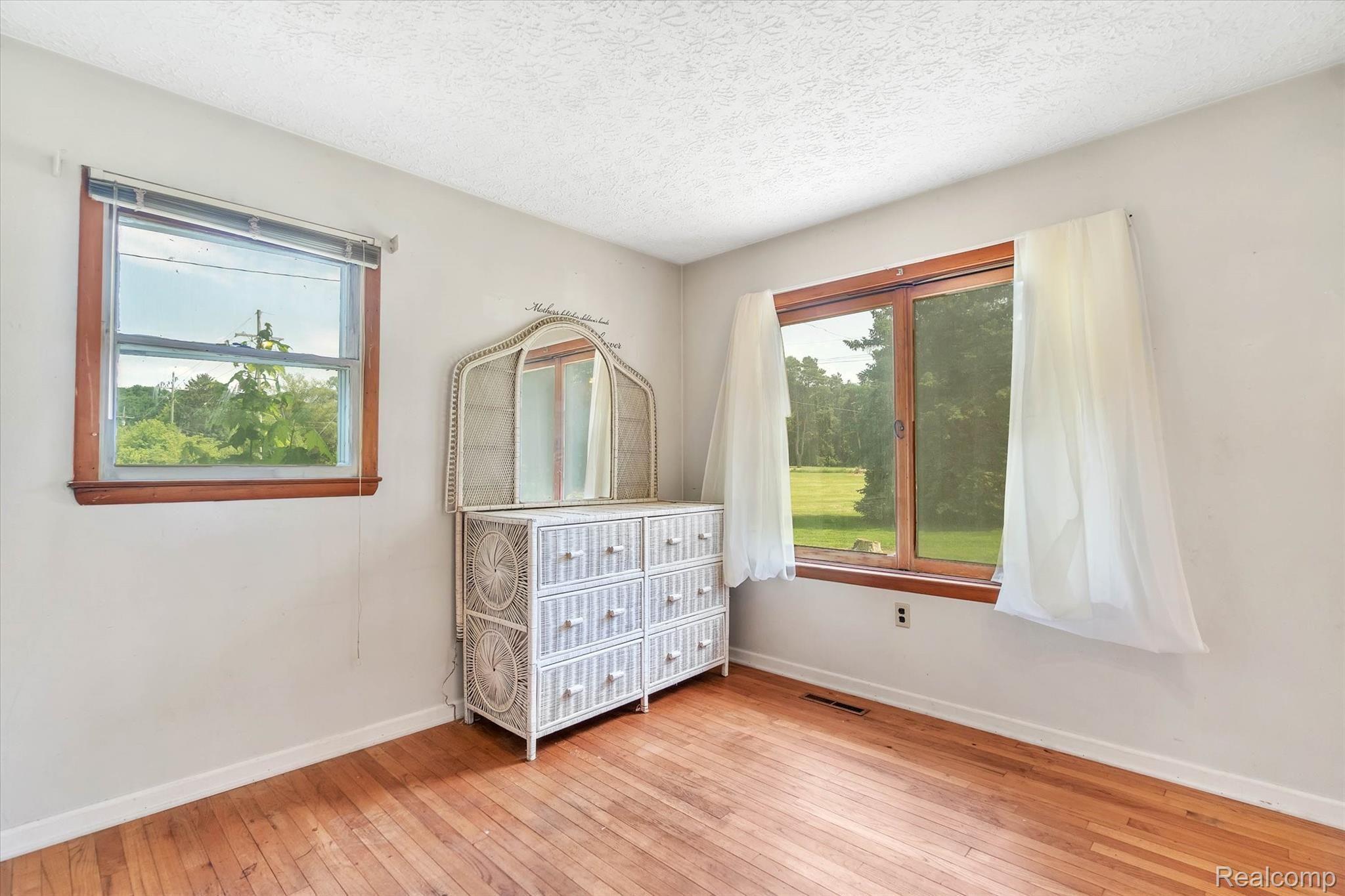 4661 Crooked Lake Road Howell, MI 48843 - Photo 20 of 47 Bedroom 2 With Hardwood Floors