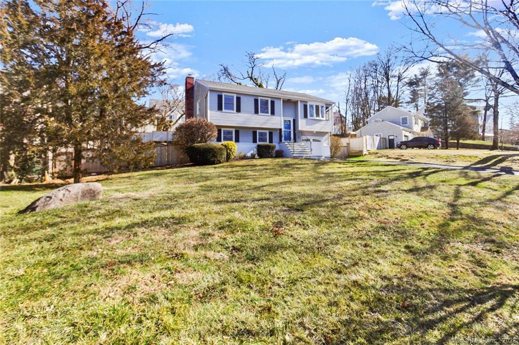 31 Woolsey Road Stamford, CT 06902 - Photo 1 of 1 a view of a house with a yard