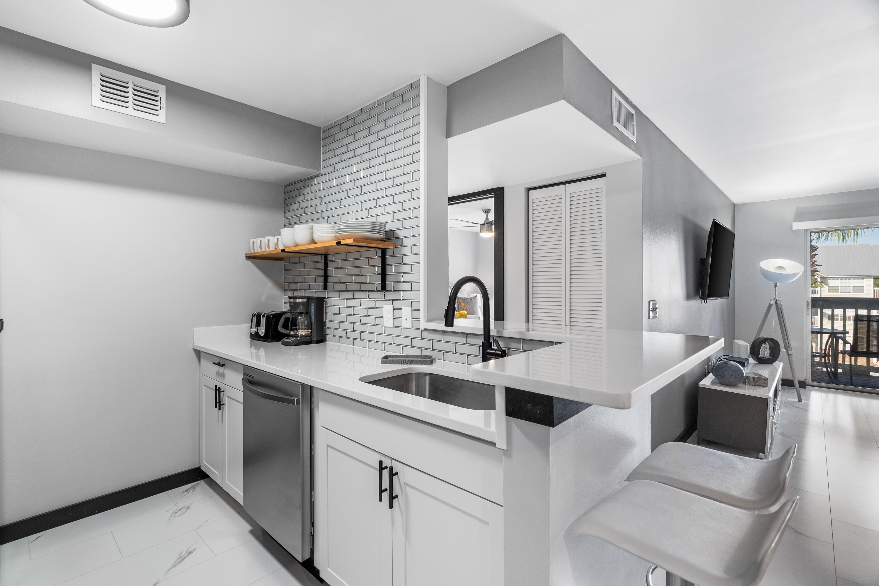 4100 Dancing Cloud Court, Unit 287 Destin, FL 32541 - Photo 1 of 26 a kitchen with stainless steel appliances a sink and a refrigerator