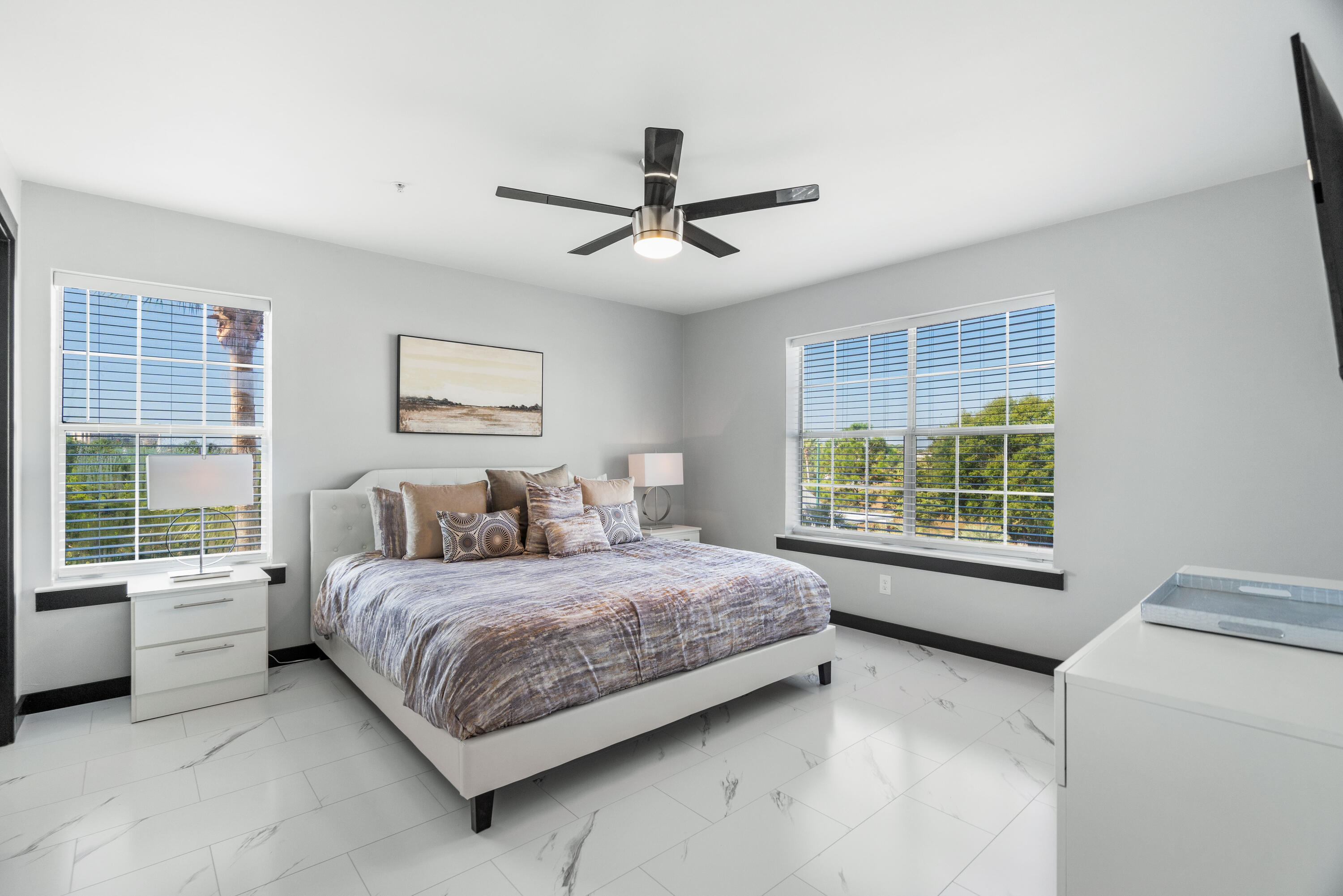 4100 Dancing Cloud Court, Unit 287 Destin, FL 32541 - Photo 11 of 26 a bedroom with a large bed and a chandelier fan