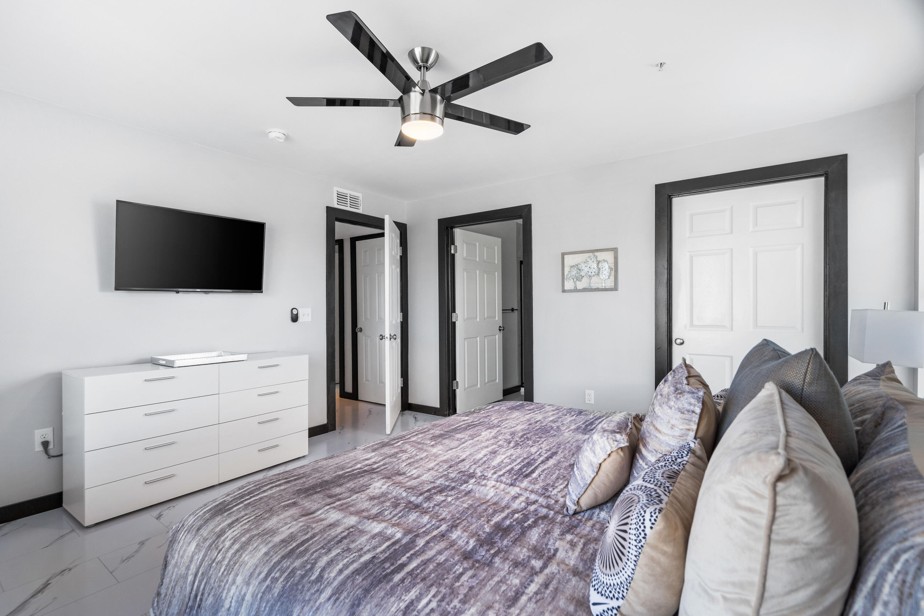 4100 Dancing Cloud Court, Unit 287 Destin, FL 32541 - Photo 14 of 26 a bedroom with a bed and a flat screen tv