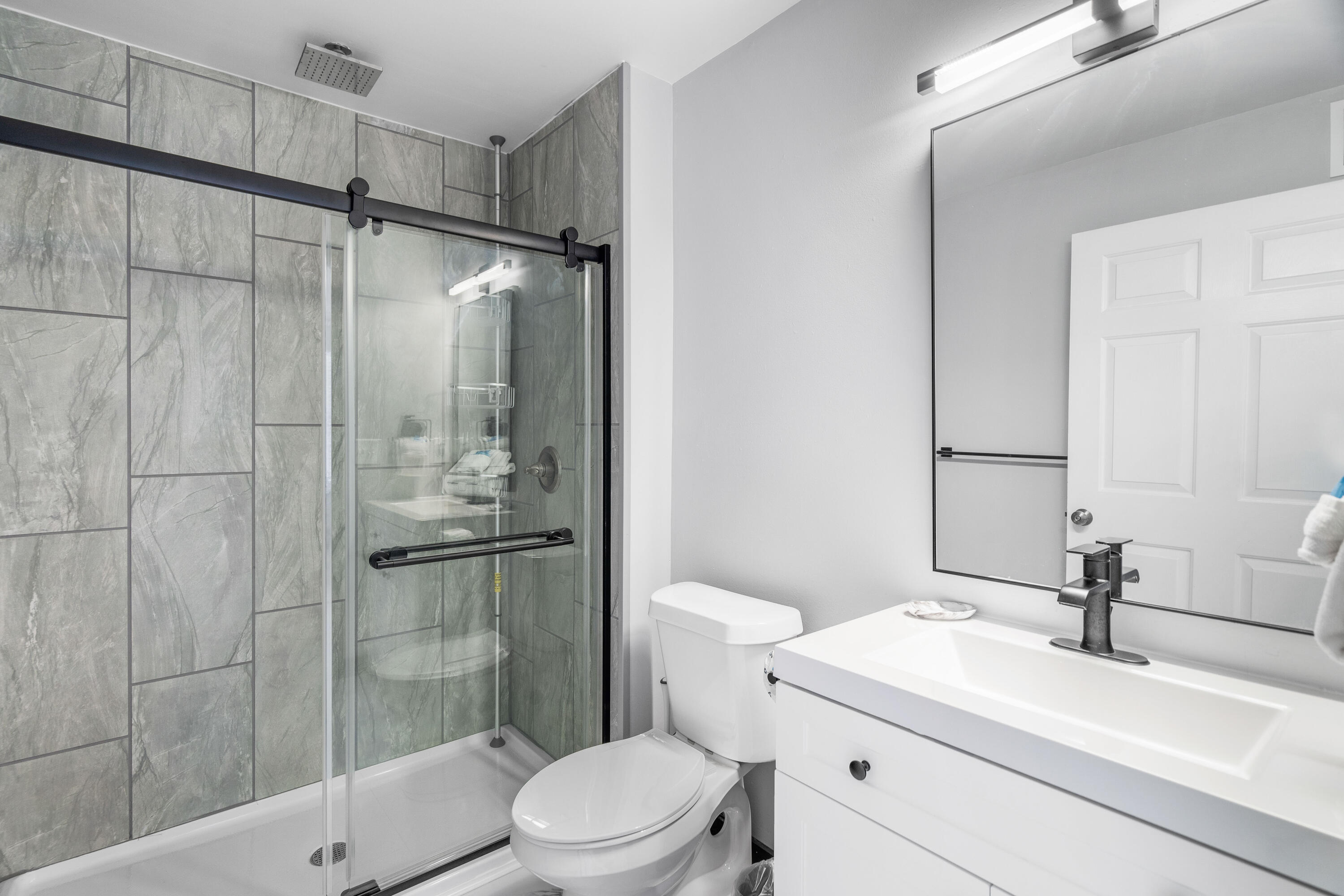 4100 Dancing Cloud Court, Unit 287 Destin, FL 32541 - Photo 15 of 26 a bathroom with a sink a toilet and shower