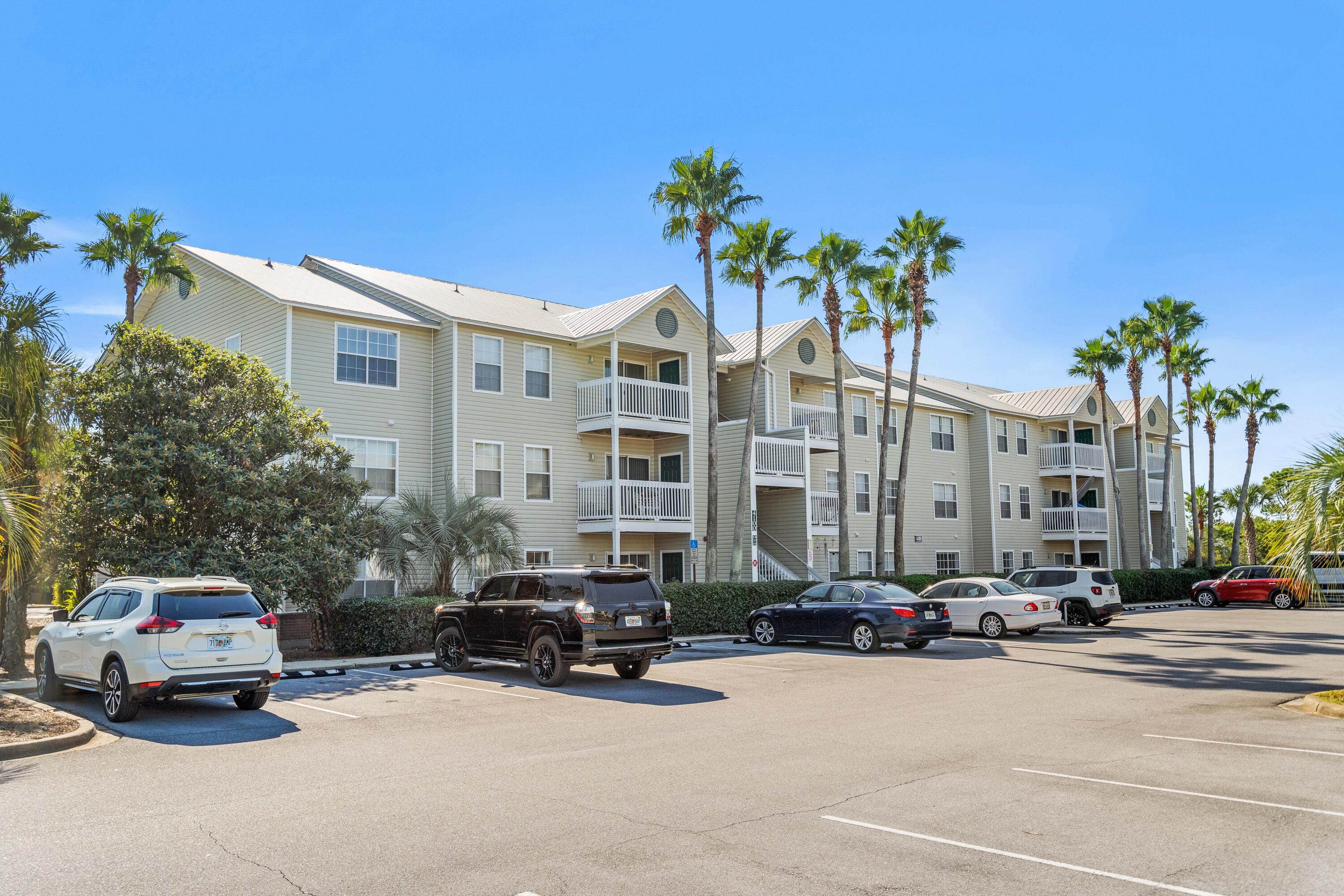 4100 Dancing Cloud Court, Unit 287 Destin, FL 32541 - Photo 18 of 26 a car parked in front of a building