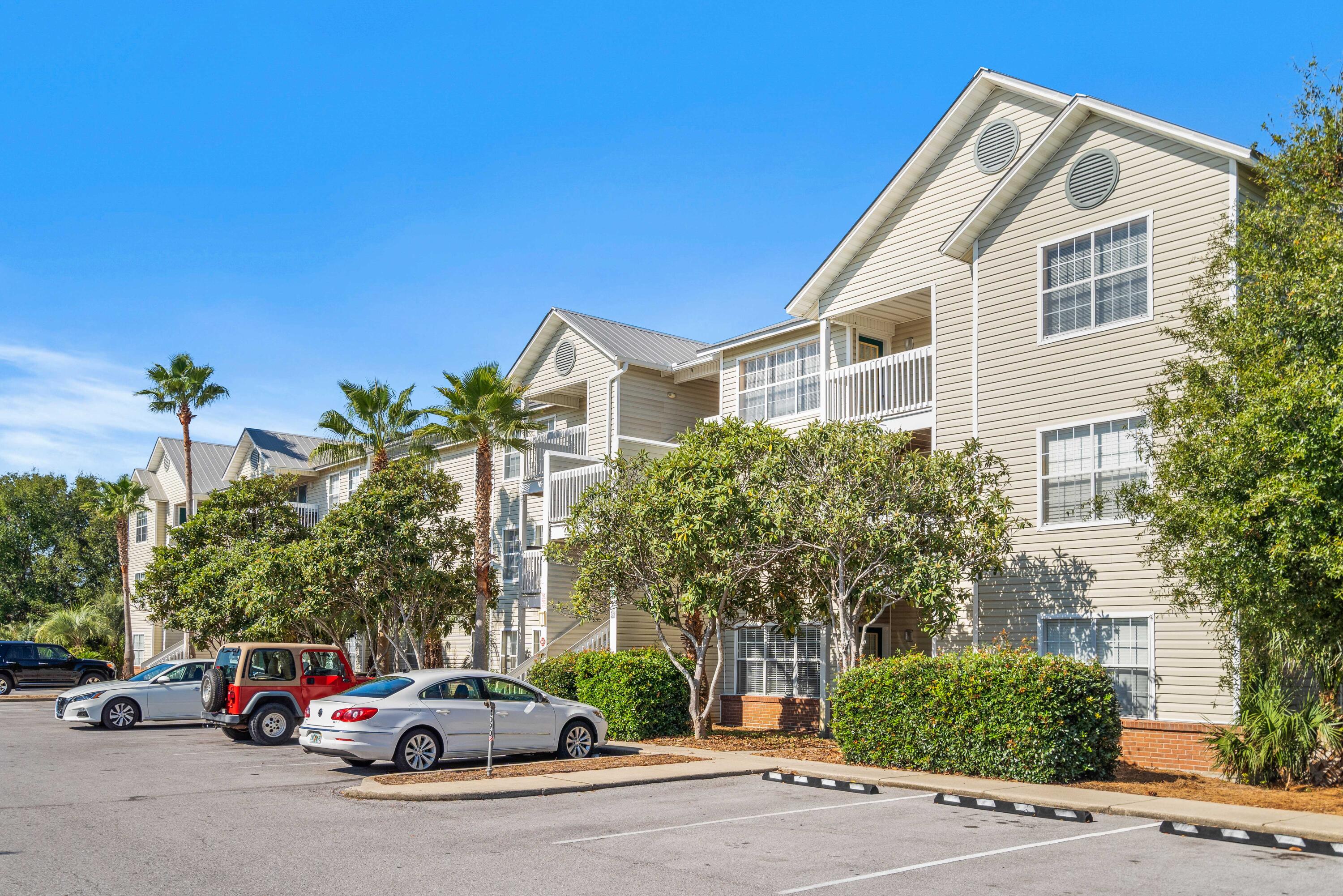 4100 Dancing Cloud Court, Unit 287 Destin, FL 32541 - Photo 19 of 26 a car parked in front of a house with a parked car
