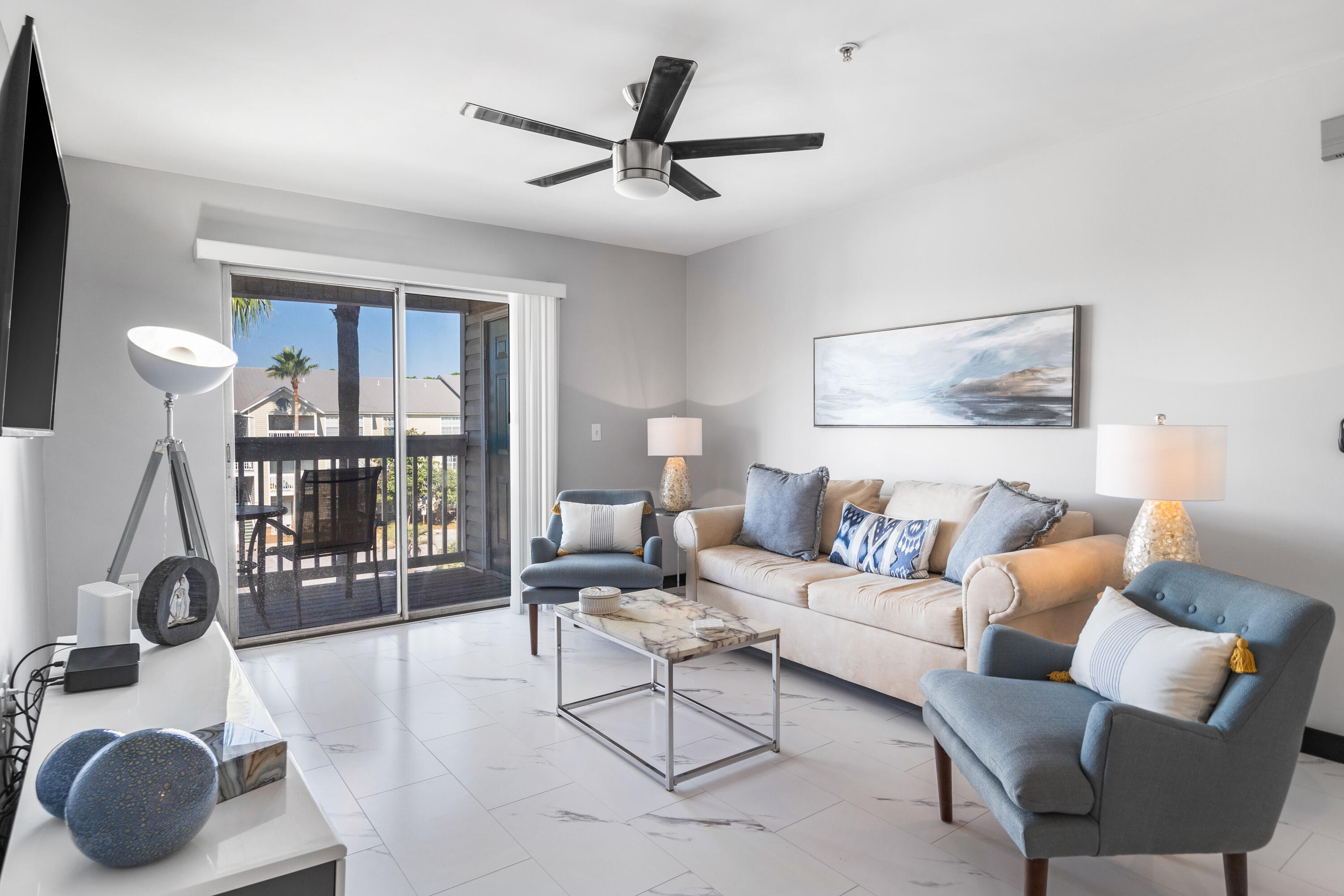 4100 Dancing Cloud Court, Unit 287 Destin, FL 32541 - Photo 2 of 26 a living room with furniture a ceiling fan and a window