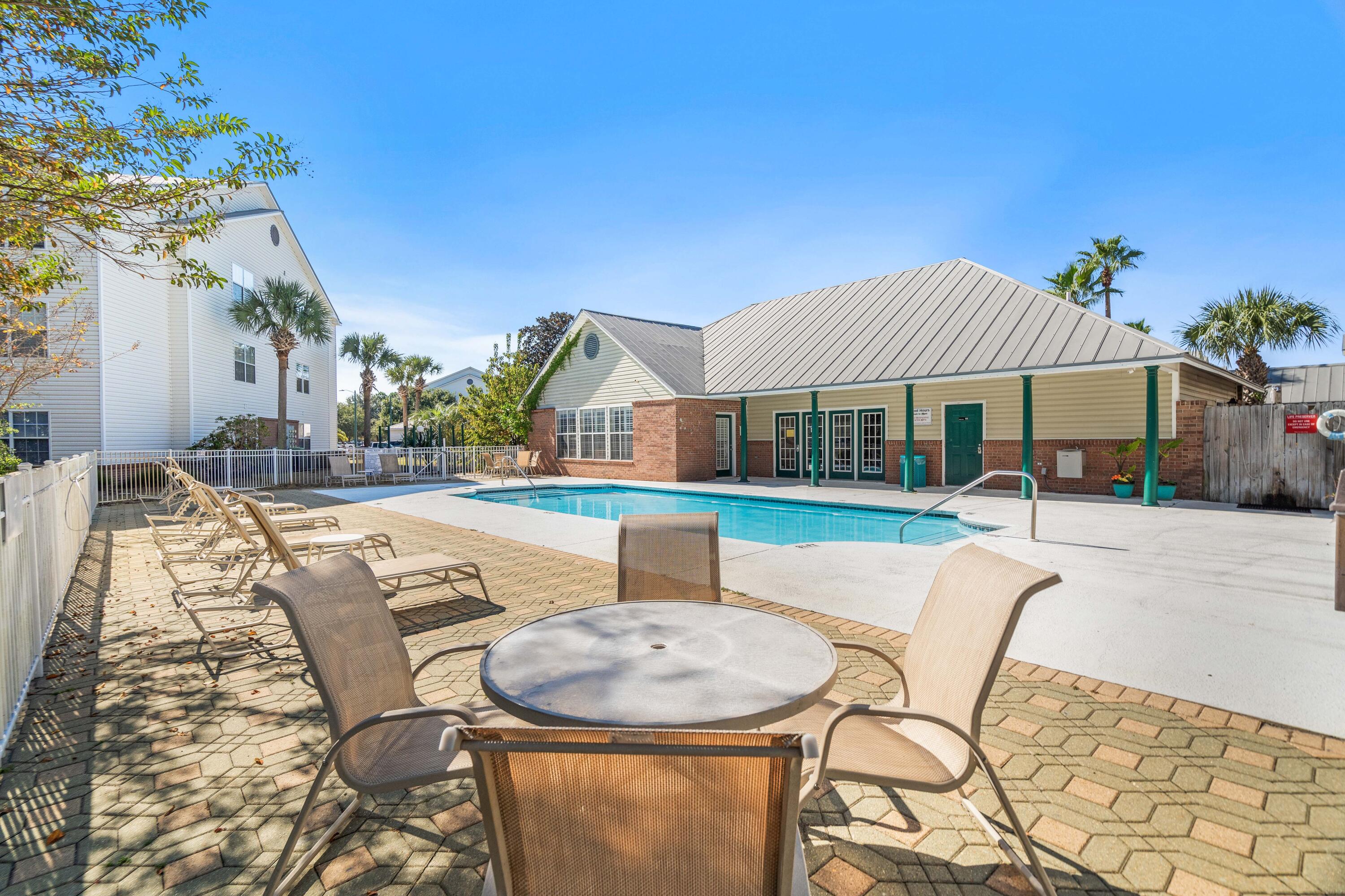 4100 Dancing Cloud Court, Unit 287 Destin, FL 32541 - Photo 21 of 26 a view of a house with swimming pool and sitting area