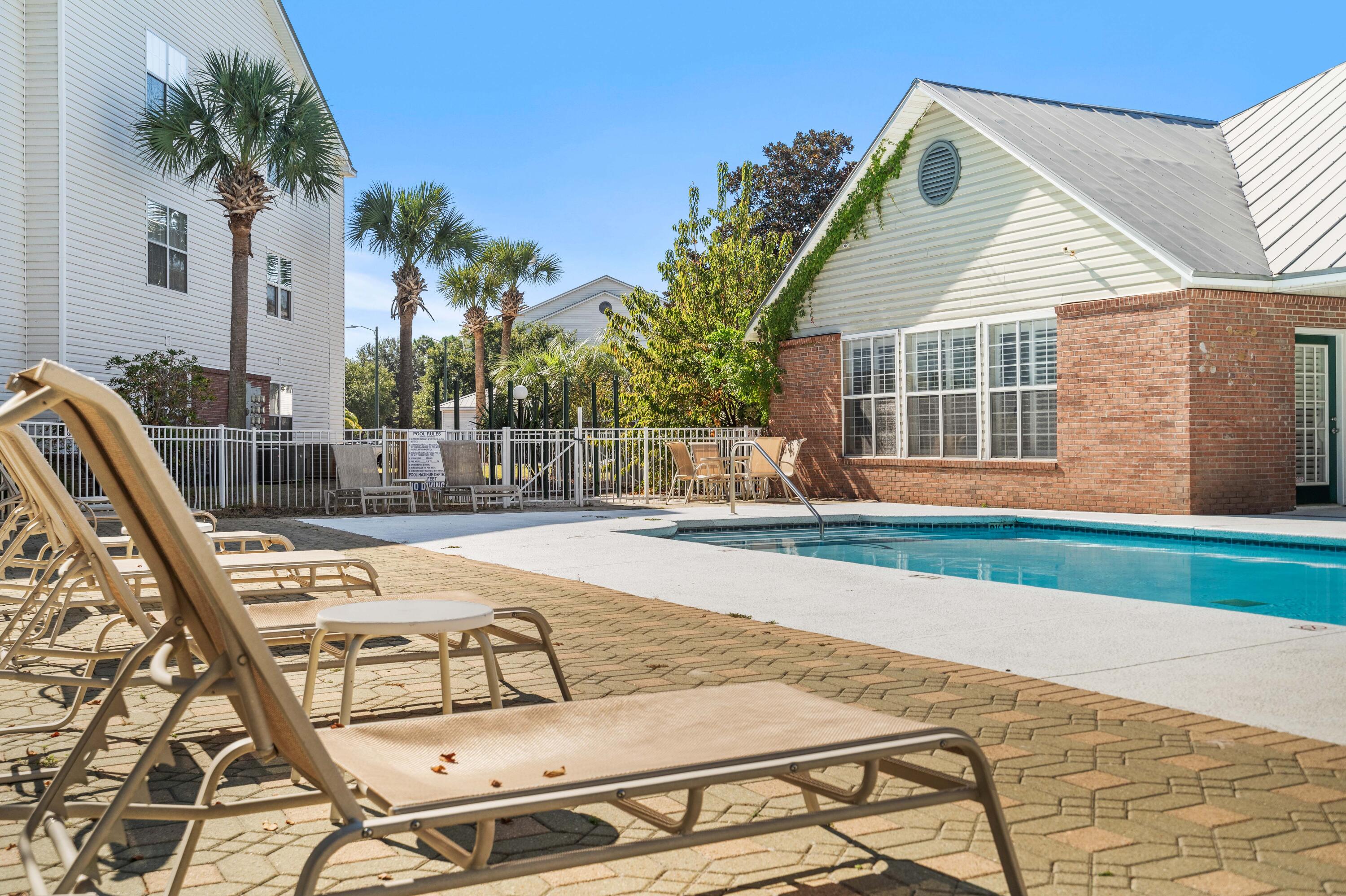 4100 Dancing Cloud Court, Unit 287 Destin, FL 32541 - Photo 22 of 26 a view of a house with backyard and sitting area
