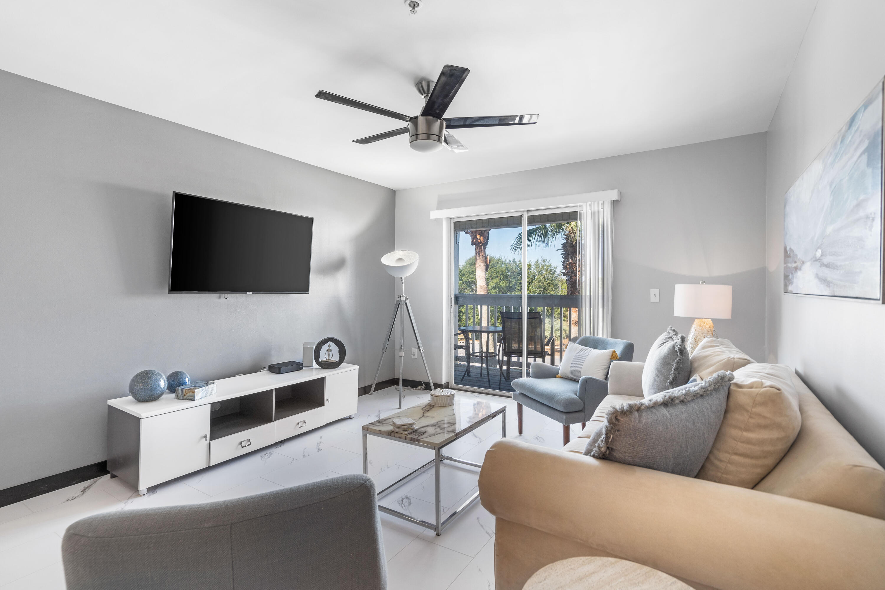4100 Dancing Cloud Court, Unit 287 Destin, FL 32541 - Photo 3 of 26 a living room with furniture and a flat screen tv