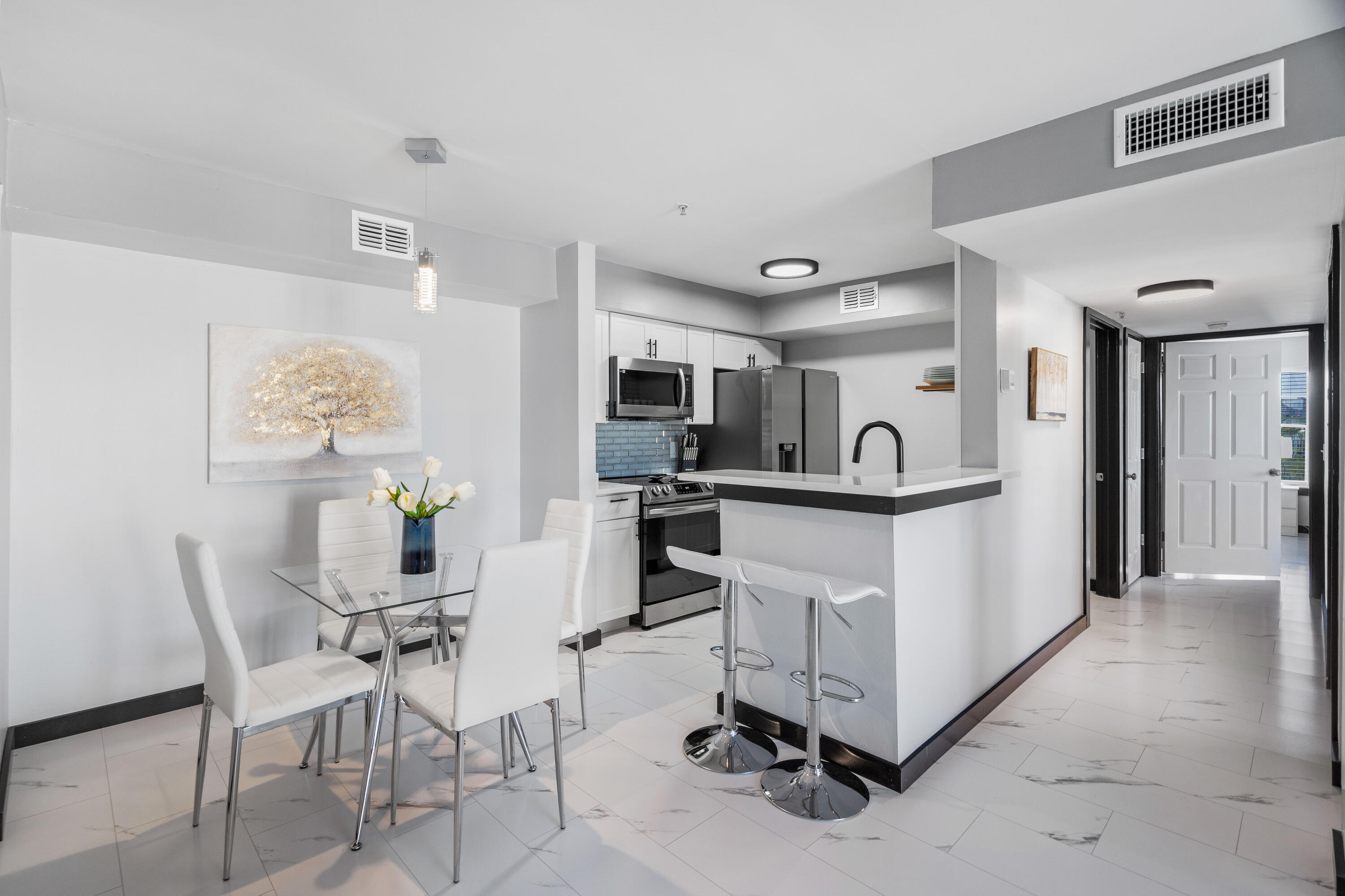 4100 Dancing Cloud Court, Unit 287 Destin, FL 32541 - Photo 4 of 26 a view of kitchen with cabinets and chairs