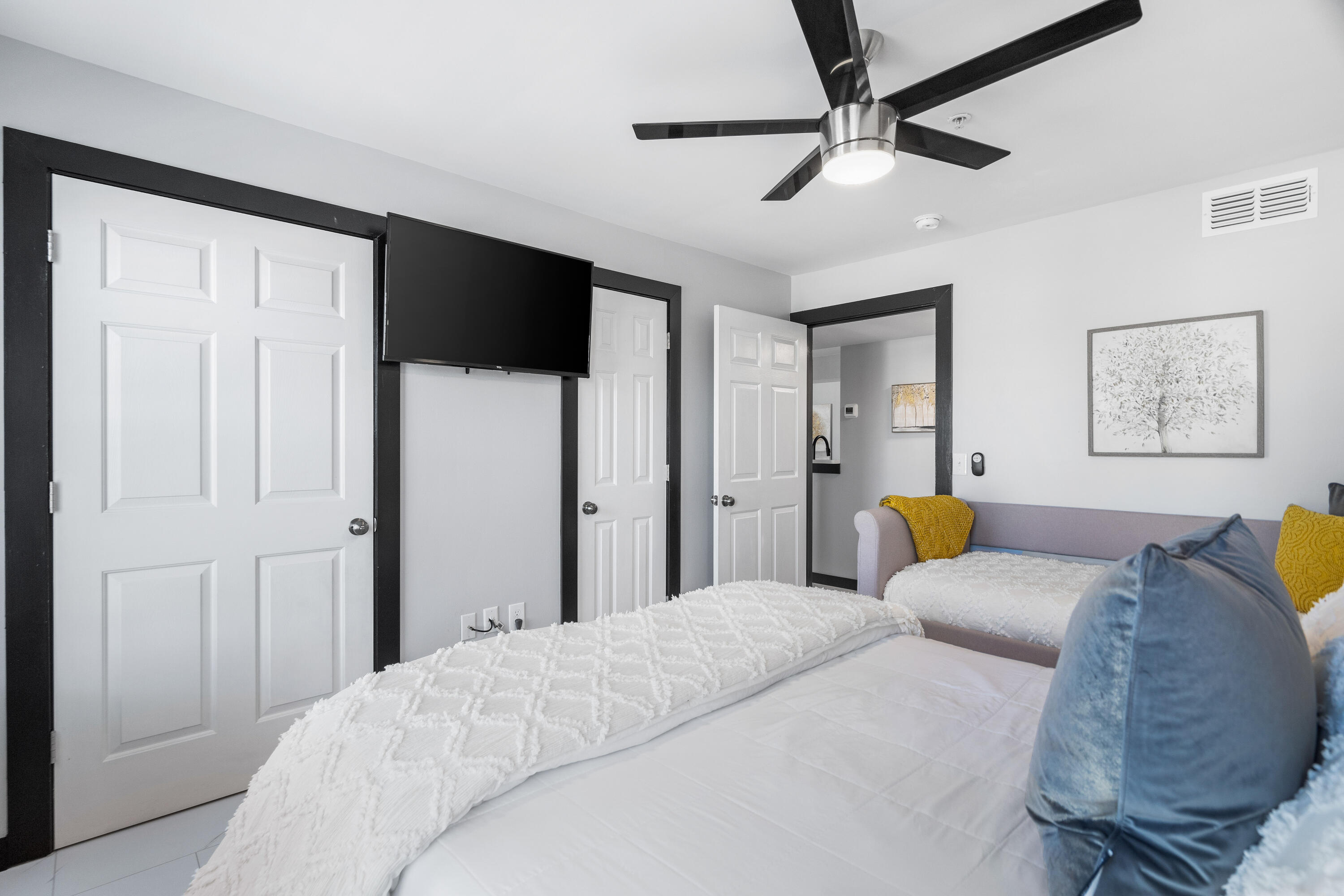 4100 Dancing Cloud Court, Unit 287 Destin, FL 32541 - Photo 9 of 26 a bedroom with a bed couch and window