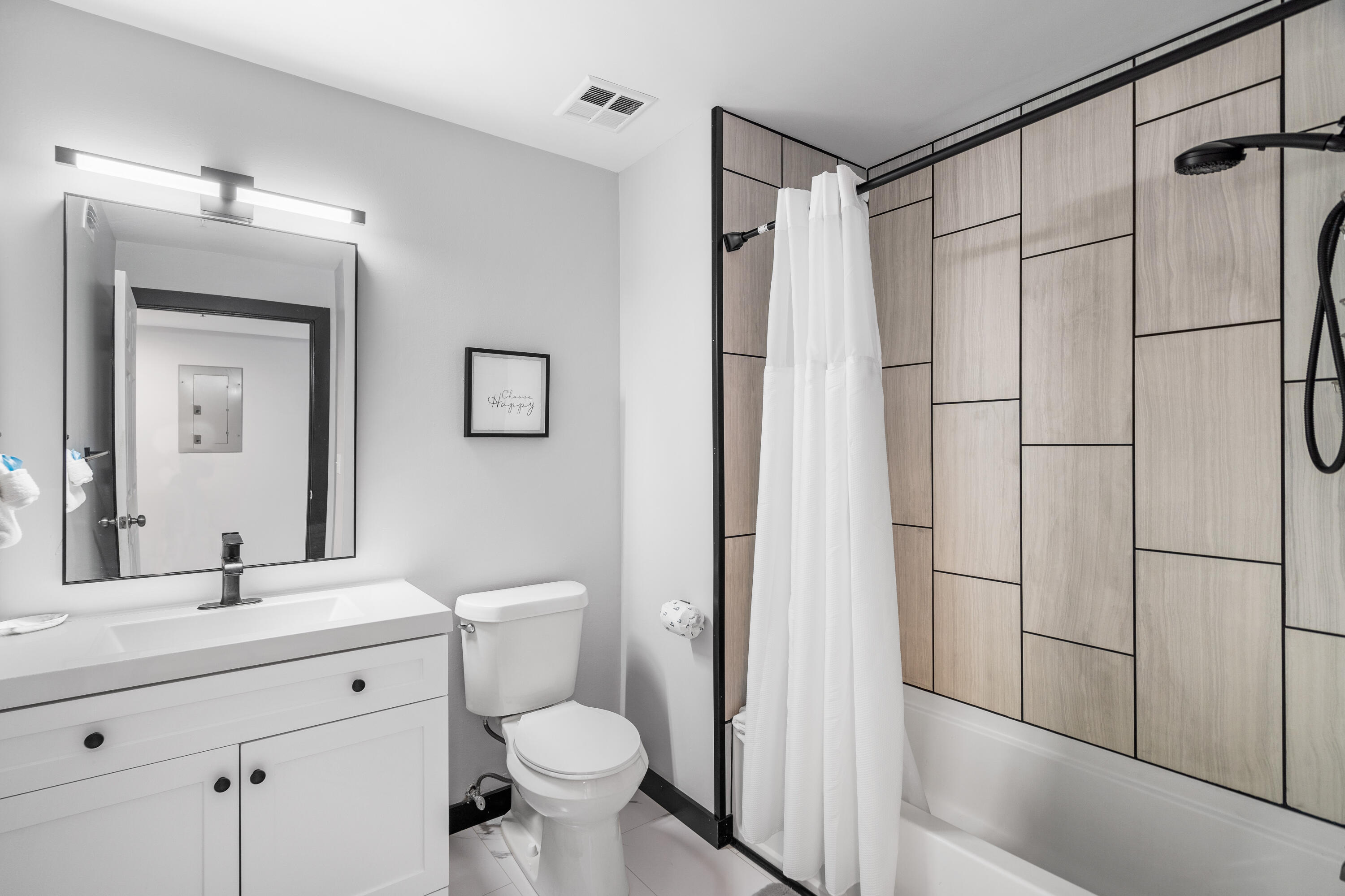 4100 Dancing Cloud Court, Unit 287 Destin, FL 32541 - Photo 10 of 26 a bathroom with a shower a sink a toilet and mirror
